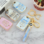 Isuzu Autoschlüsseletui, goldfarben mit Jade-Einlage